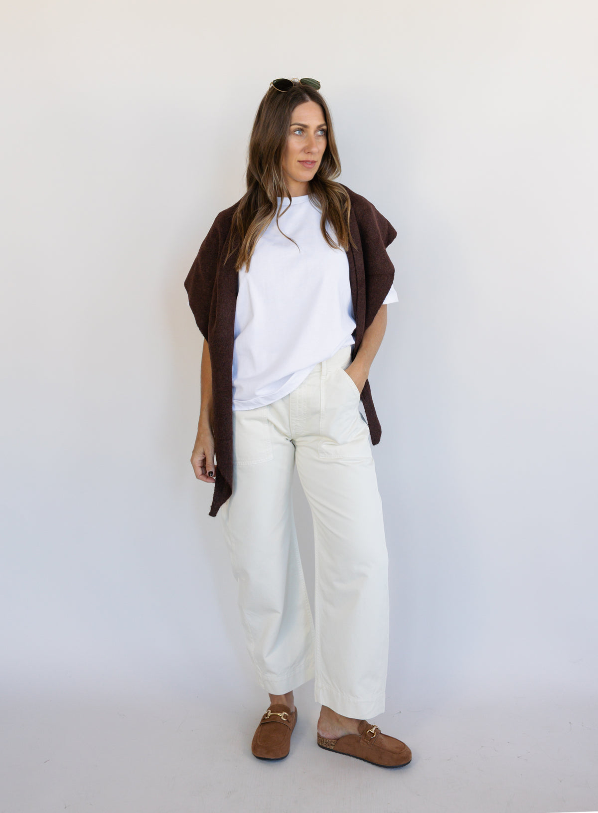 Woman wearing Favorite Daughter The Major Pant, winter white mid-rise barrel-leg cotton pants