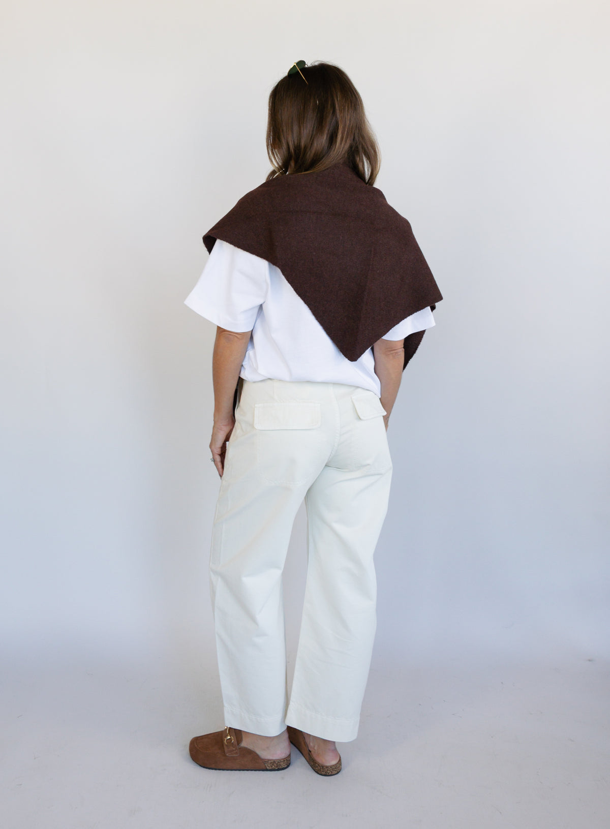 Woman wearing Favorite Daughter The Major Pant, winter white mid-rise barrel-leg cotton pants