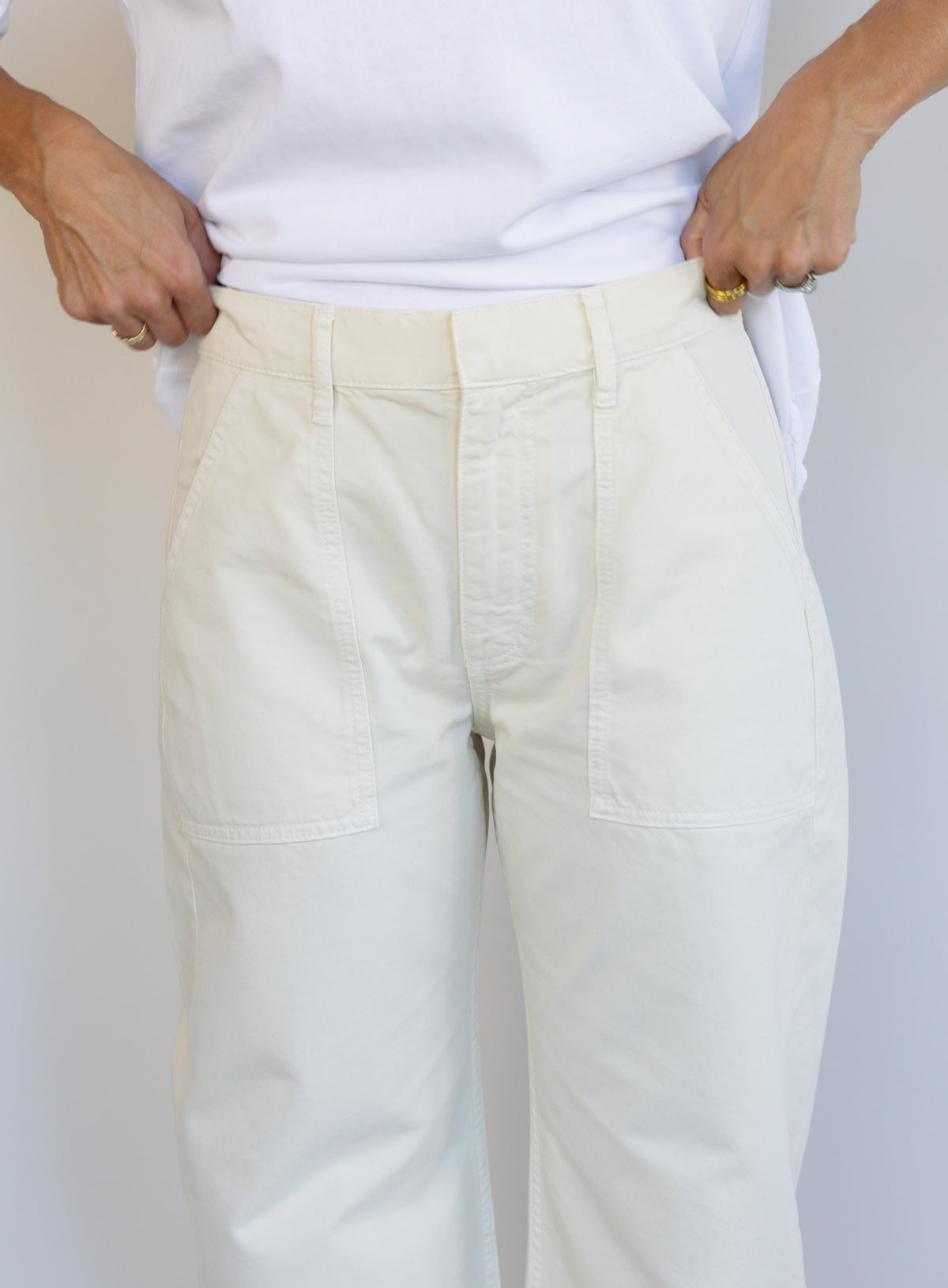 Woman wearing Favorite Daughter The Major Pant, winter white mid-rise barrel-leg cotton pants