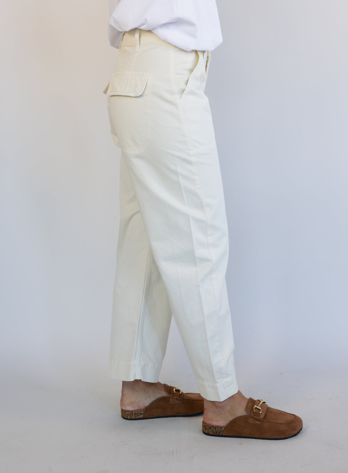 Woman wearing Favorite Daughter The Major Pant, winter white mid-rise barrel-leg cotton pants