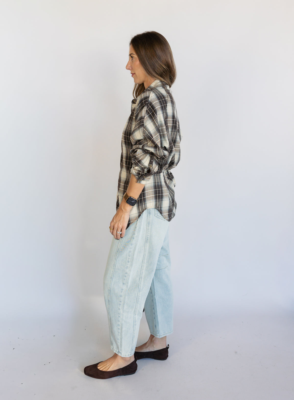 Woman wearing the Poet Barrel Denim Jeans, light-wash high-rise barrel-leg jeans
