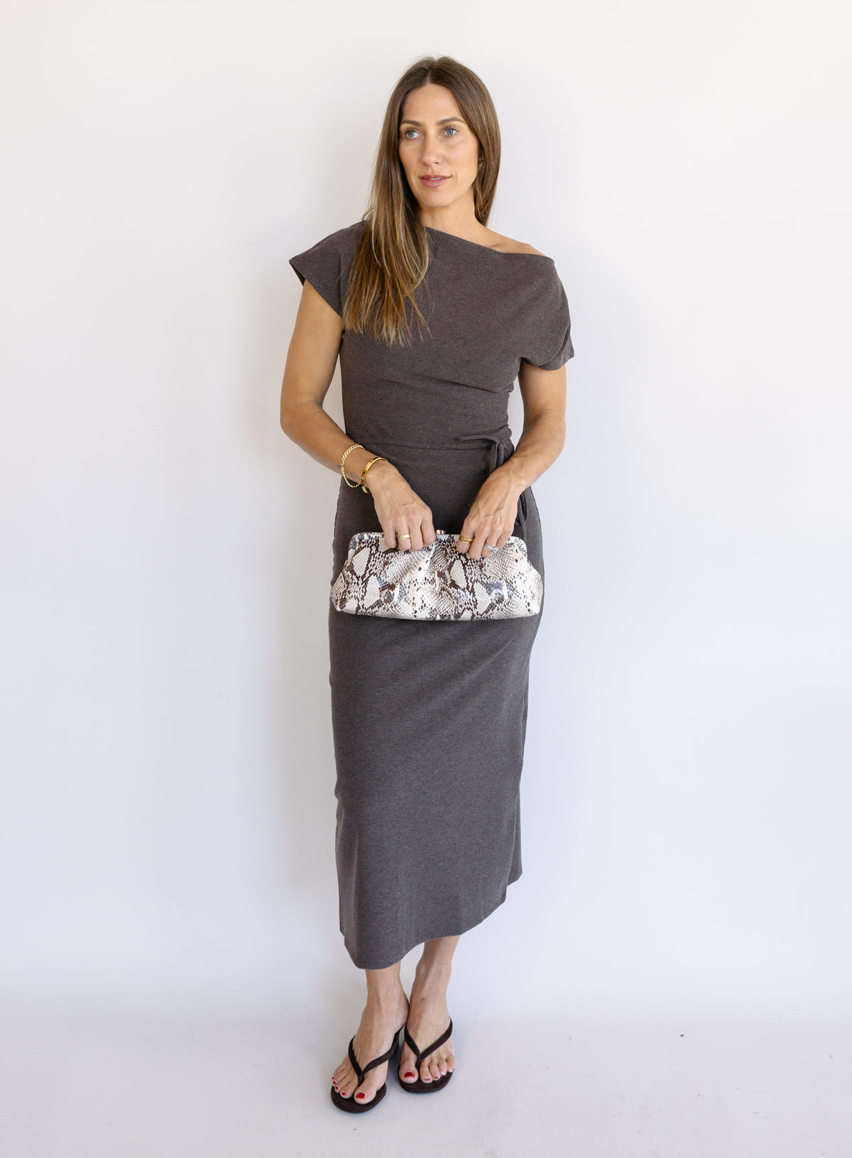 Woman wearing the Project Social T Laurel Dress, an off-the-shoulder brushed rib maxi dress with a waist tie