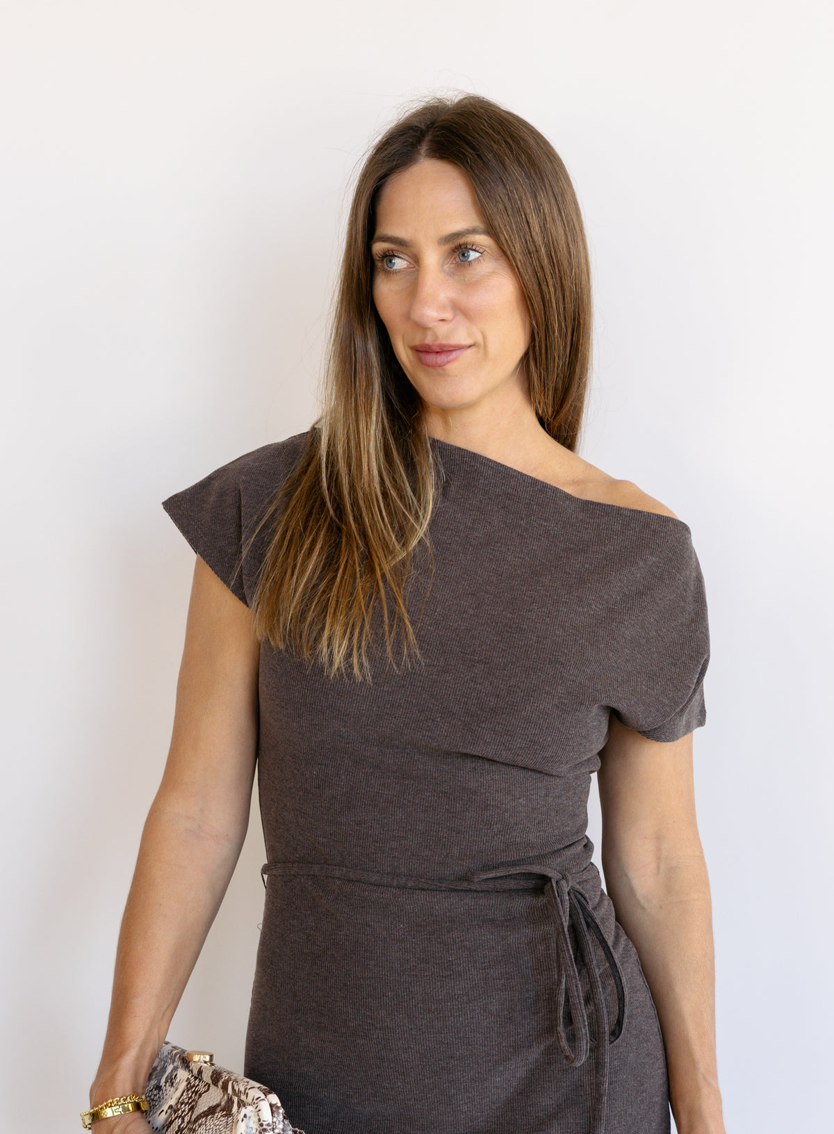 Woman wearing the Project Social T Laurel Dress, an off-the-shoulder brushed rib maxi dress with a waist tie