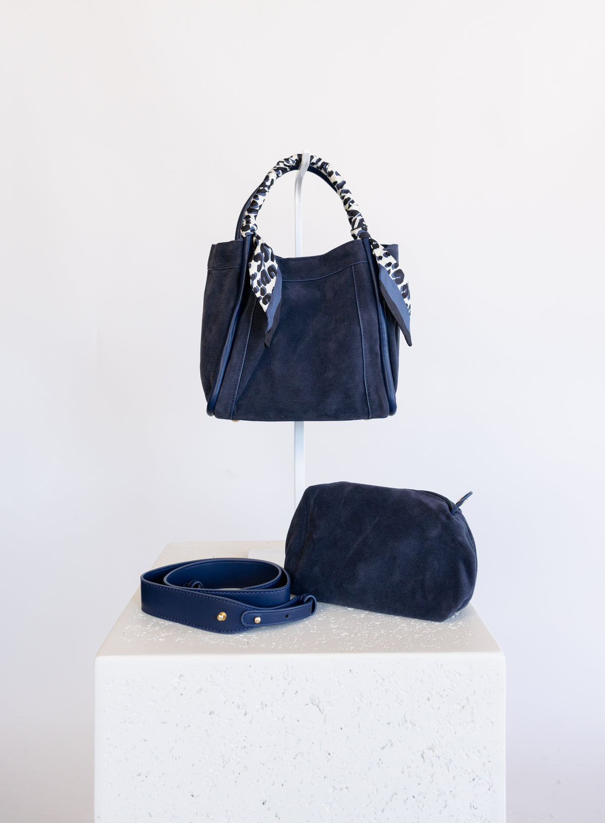 Giselle Suede Bag in Navy, a slouchy suede tote with navy and white leopard scarves on the handles