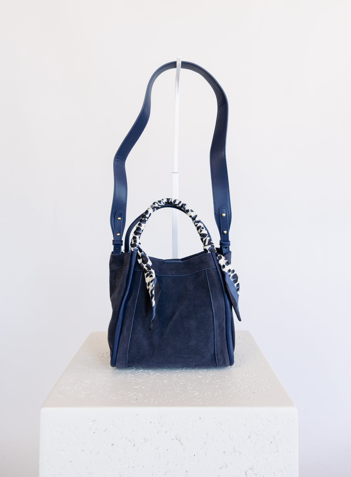 Giselle Suede Bag in Navy, a slouchy suede tote with navy and white leopard scarves on the handles