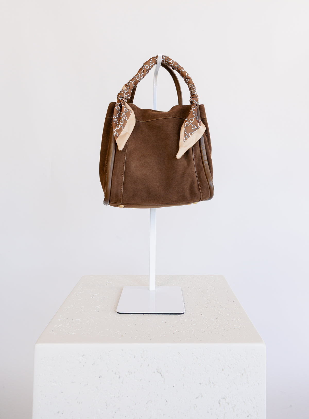 Giselle Suede Bag in Chocolate, a slouchy suede tote with cream chain-print scarves on the handles