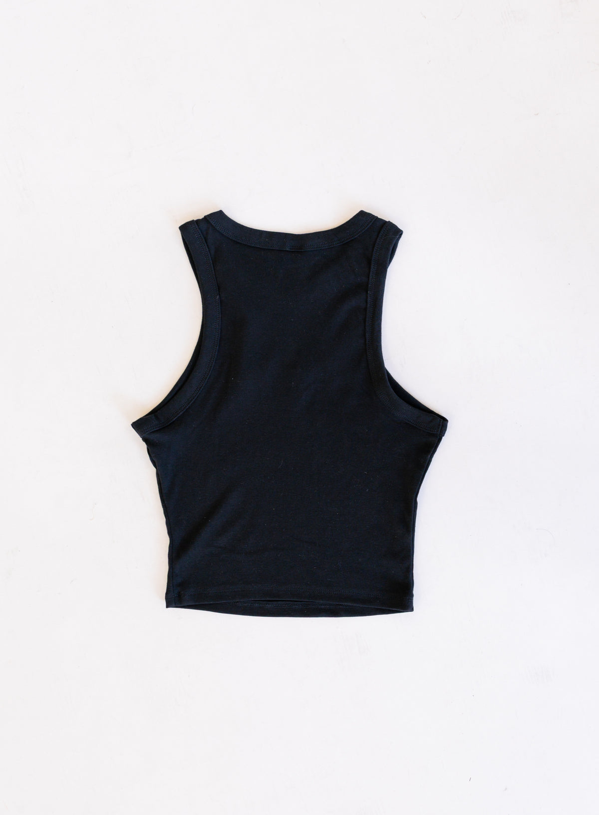 Jags Embroidered Crop Tank, a jet black high-neck crop tank with a teal and gold embroidered jaguar