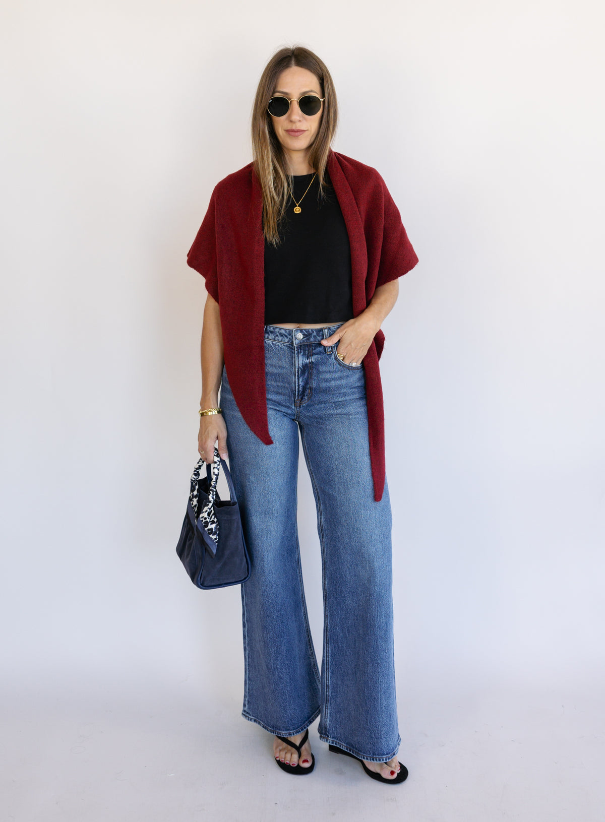 Woman wearing Z Supply The Stunner Mid Rise Wide Leg jeans in Element, a vintage medium wash