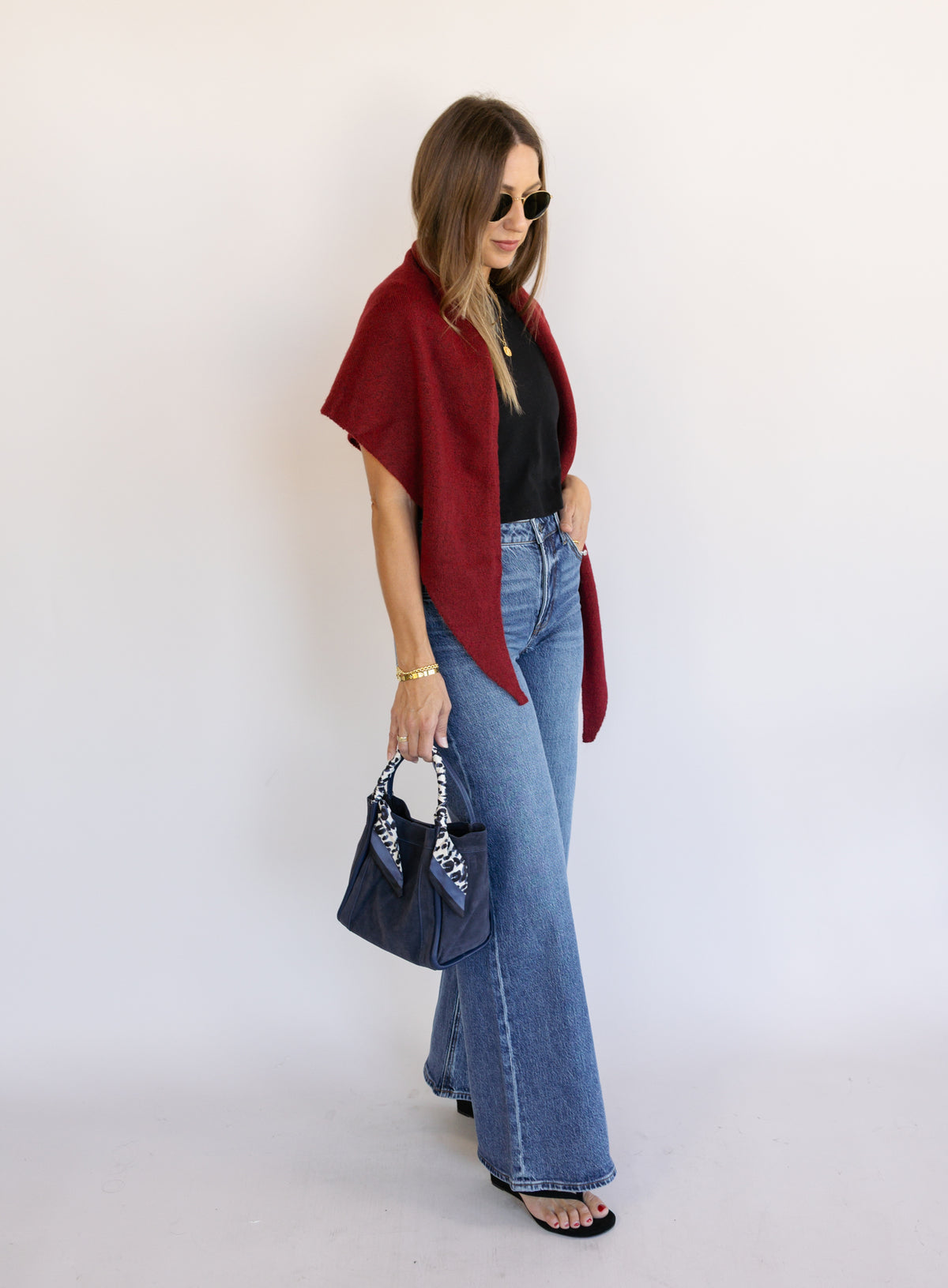 Woman wearing Z Supply The Stunner Mid Rise Wide Leg jeans in Element, a vintage medium wash
