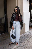 Woman wearing the ASTR The Label Kyra Sheer Mesh Mock Neck Top, a fitted wine top with floral lace detailing