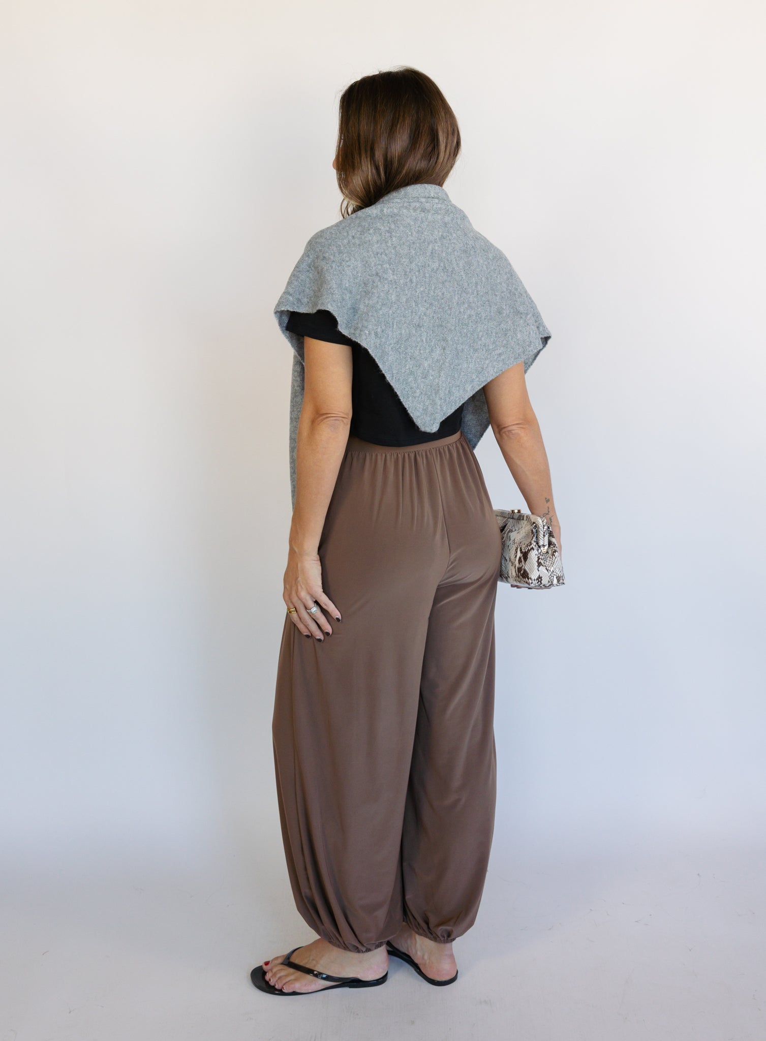 Woman wearing the Rome Relaxed Fit Balloon Pants in Coffee, brown high-rise pull-on balloon pants