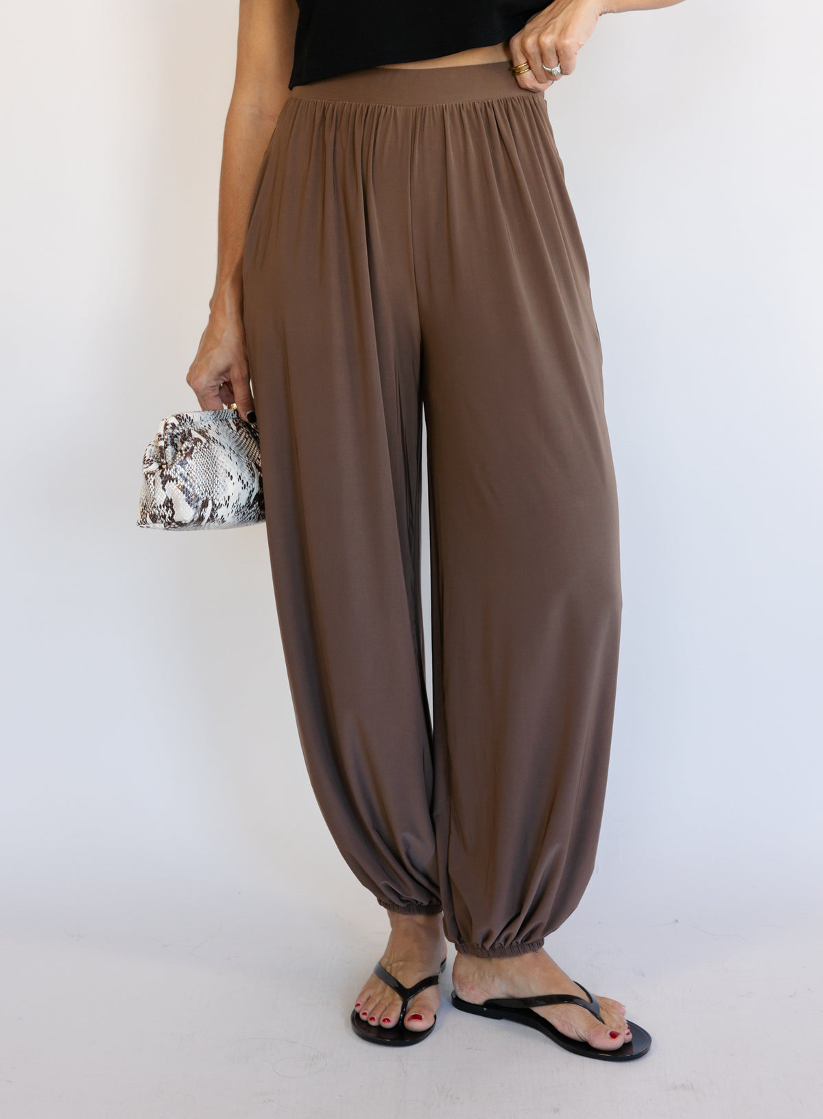 Woman wearing the Rome Relaxed Fit Balloon Pants in Coffee, brown high-rise pull-on balloon pants