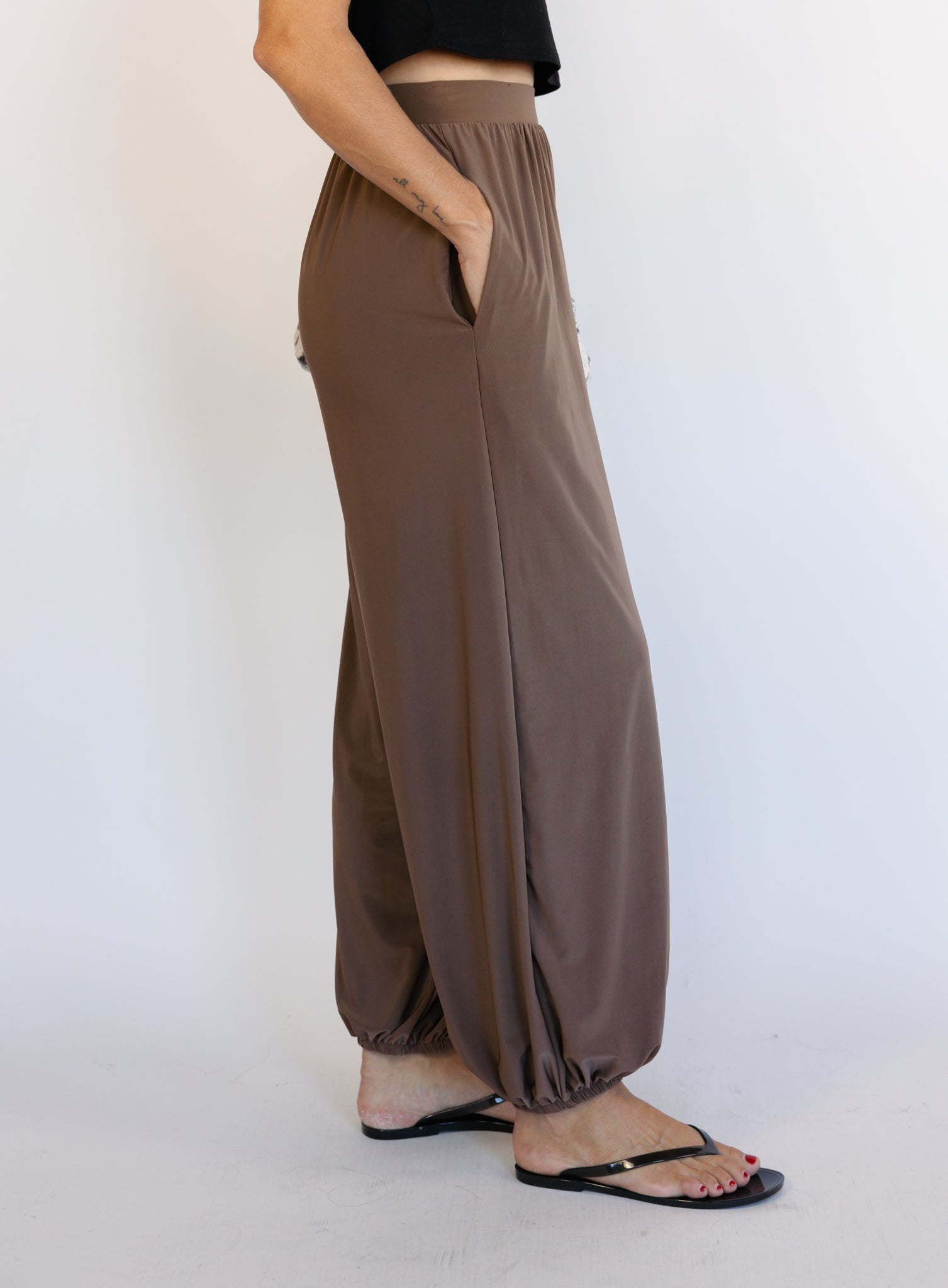 Woman wearing the Rome Relaxed Fit Balloon Pants in Coffee, brown high-rise pull-on balloon pants