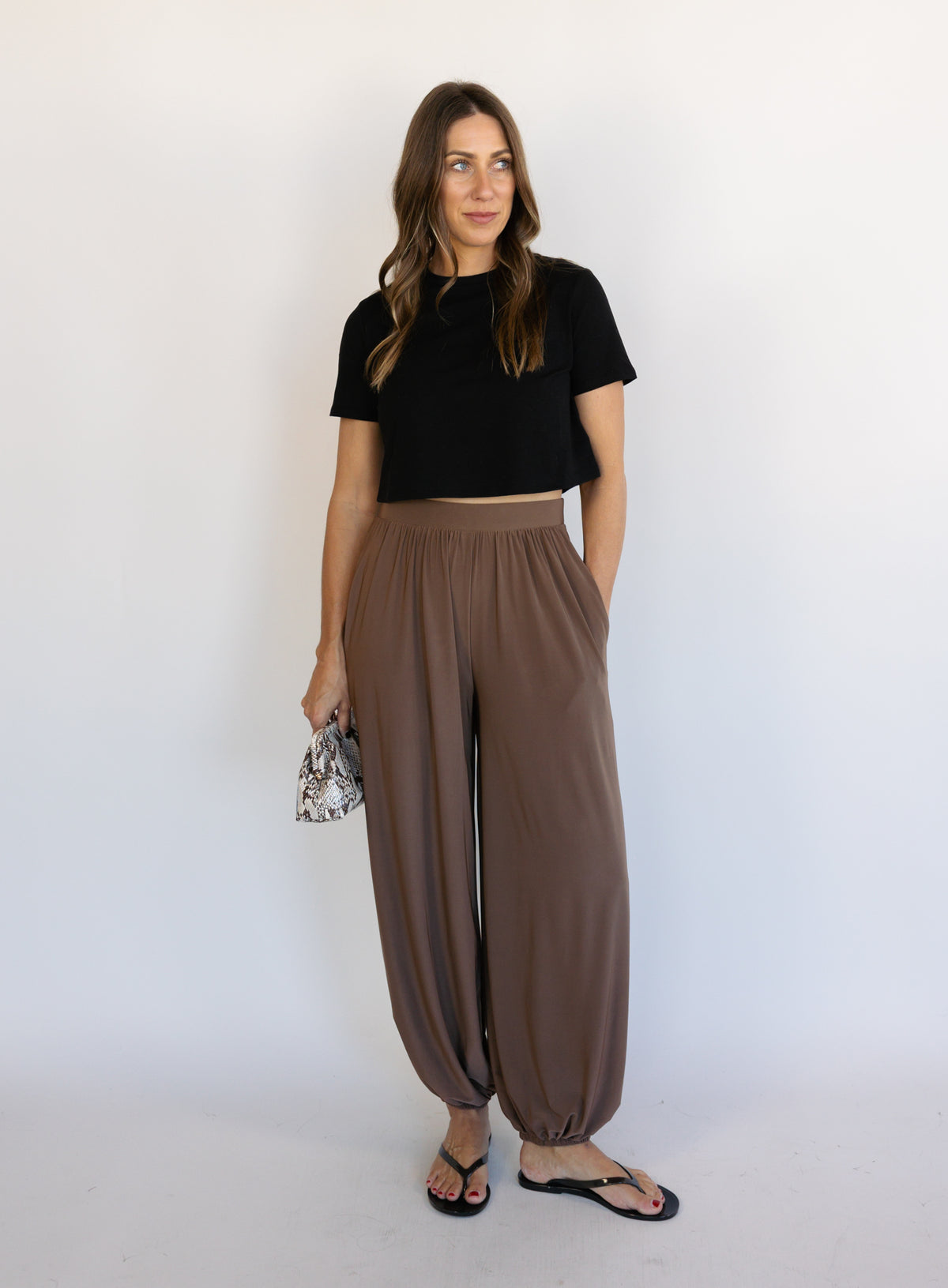 Woman wearing the Rome Relaxed Fit Balloon Pants in Coffee, brown high-rise pull-on balloon pants