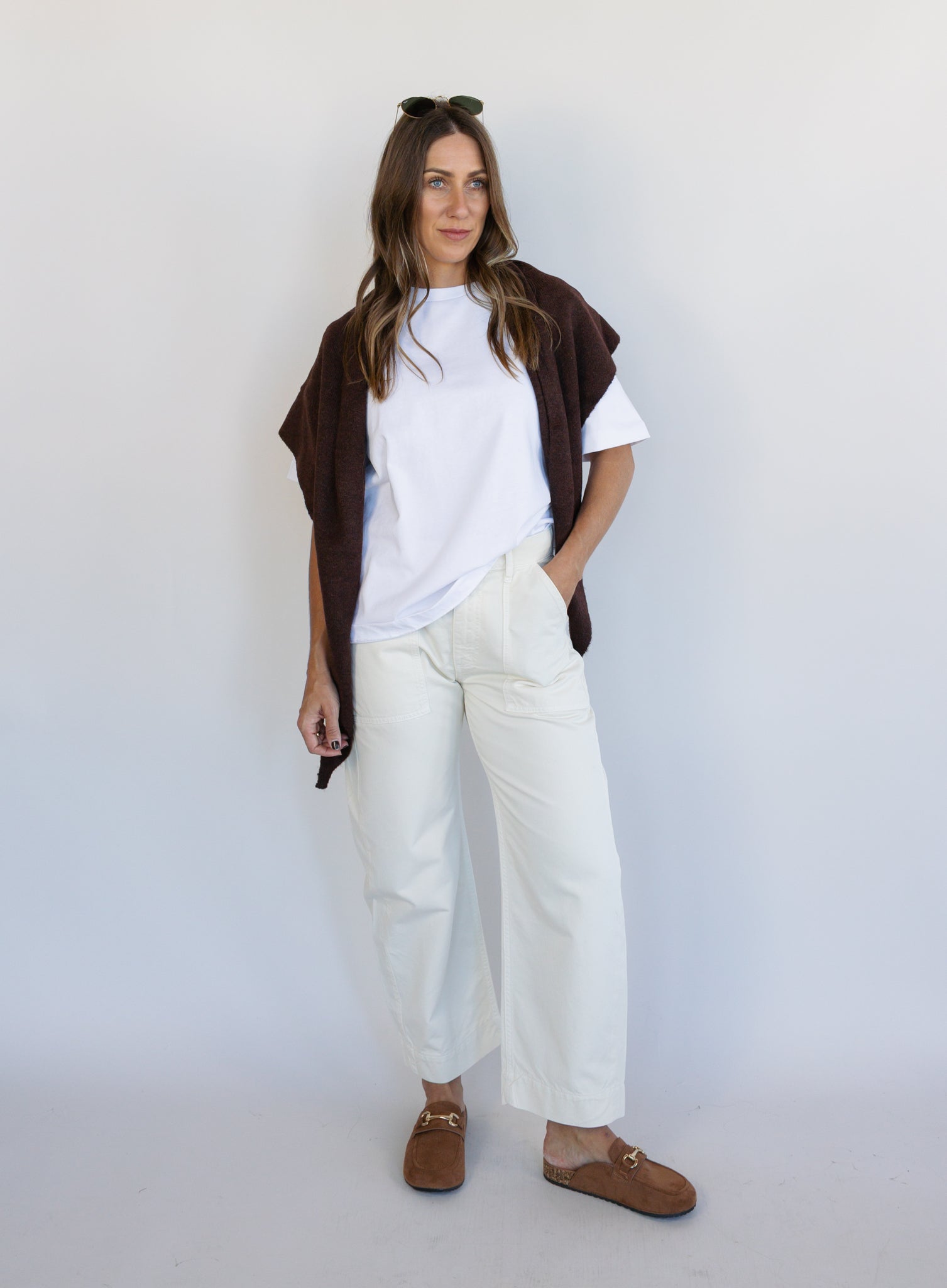 Woman wearing Favorite Daughter The Major Pant, winter white mid-rise barrel-leg cotton pants