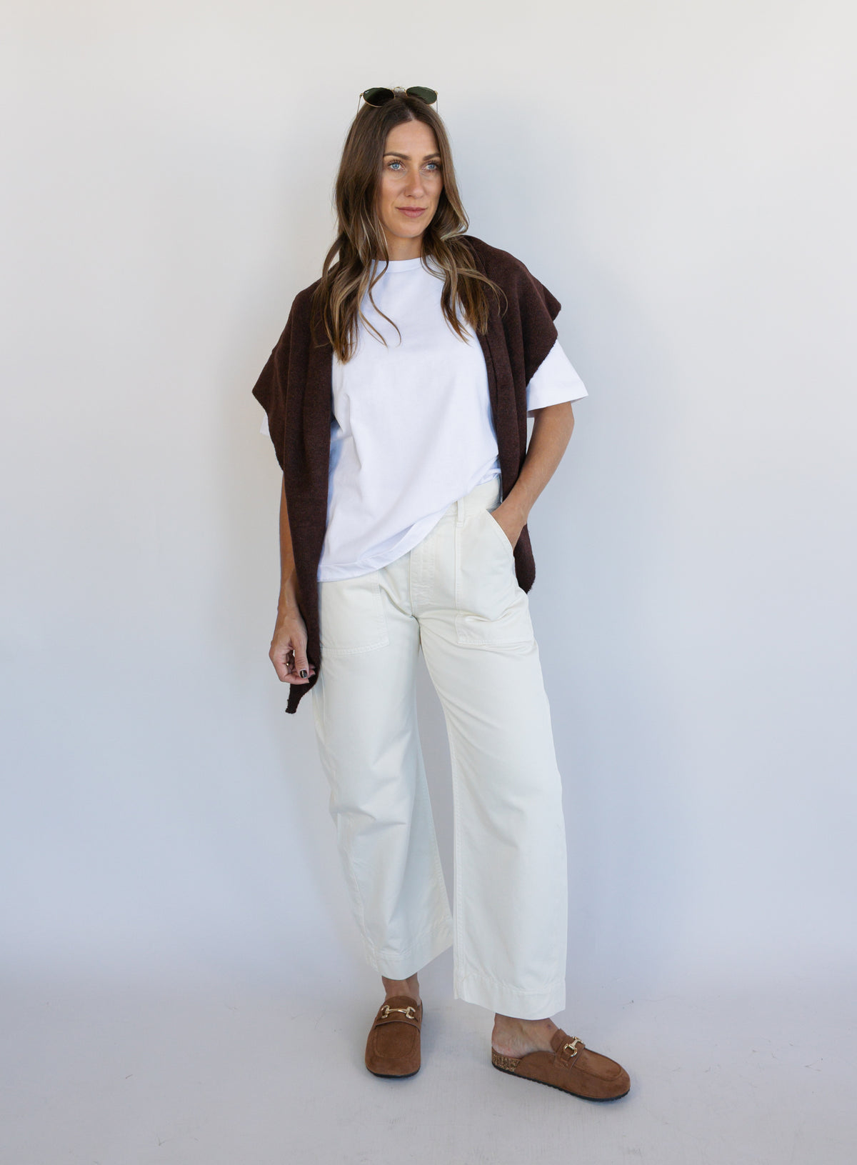Woman wearing Favorite Daughter The Major Pant, winter white mid-rise barrel-leg cotton pants