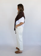 Woman wearing Favorite Daughter The Major Pant, winter white mid-rise barrel-leg cotton pants
