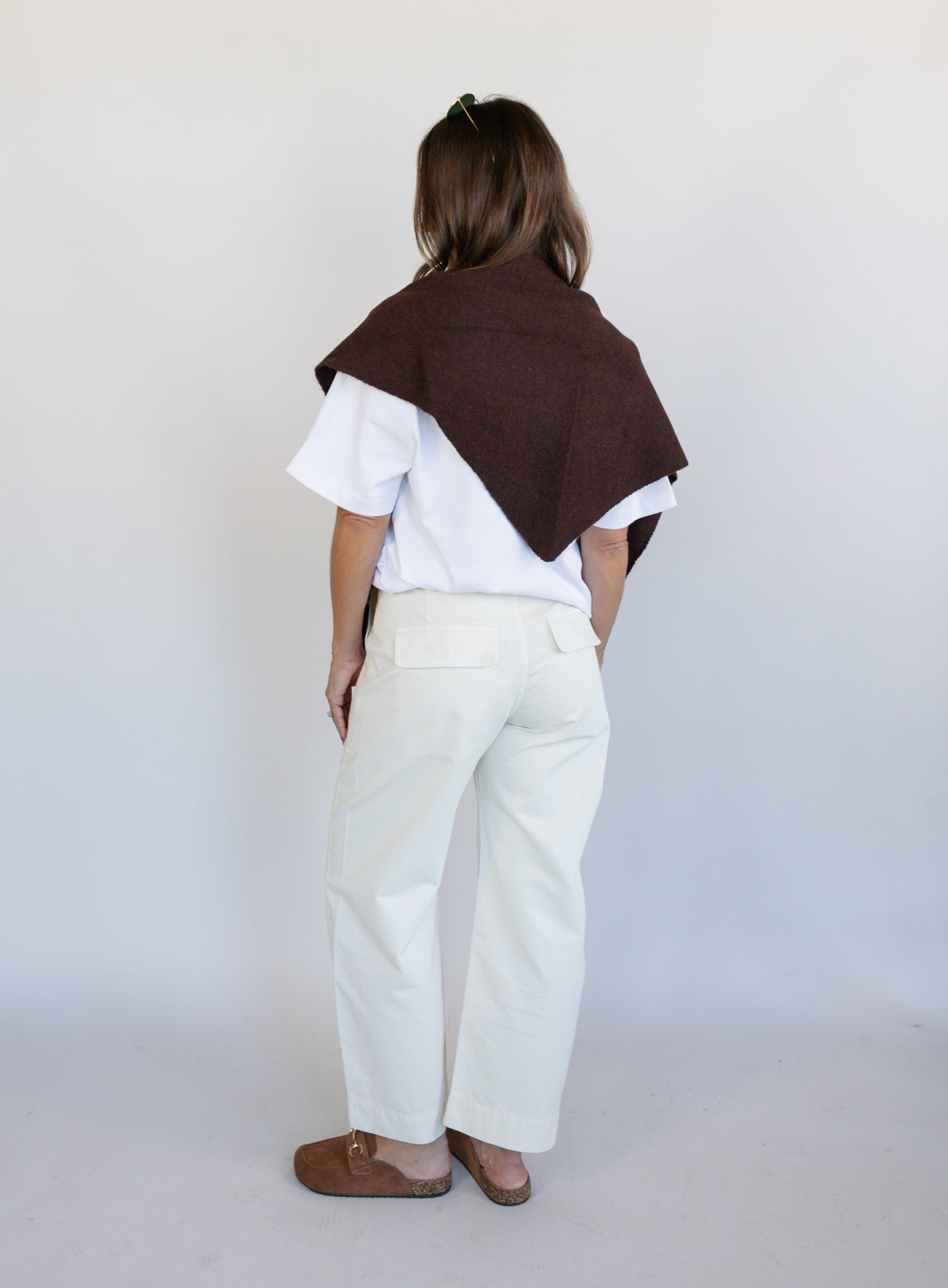 Woman wearing Favorite Daughter The Major Pant, winter white mid-rise barrel-leg cotton pants