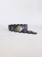 Greta Wide Western Belt in Black, a wide black disc belt with silver grommets and a concho buckle