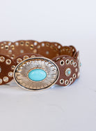 Mirabel Turquoise Disc Belt, a tan disc belt with silver grommets and a turquoise-tone buckle