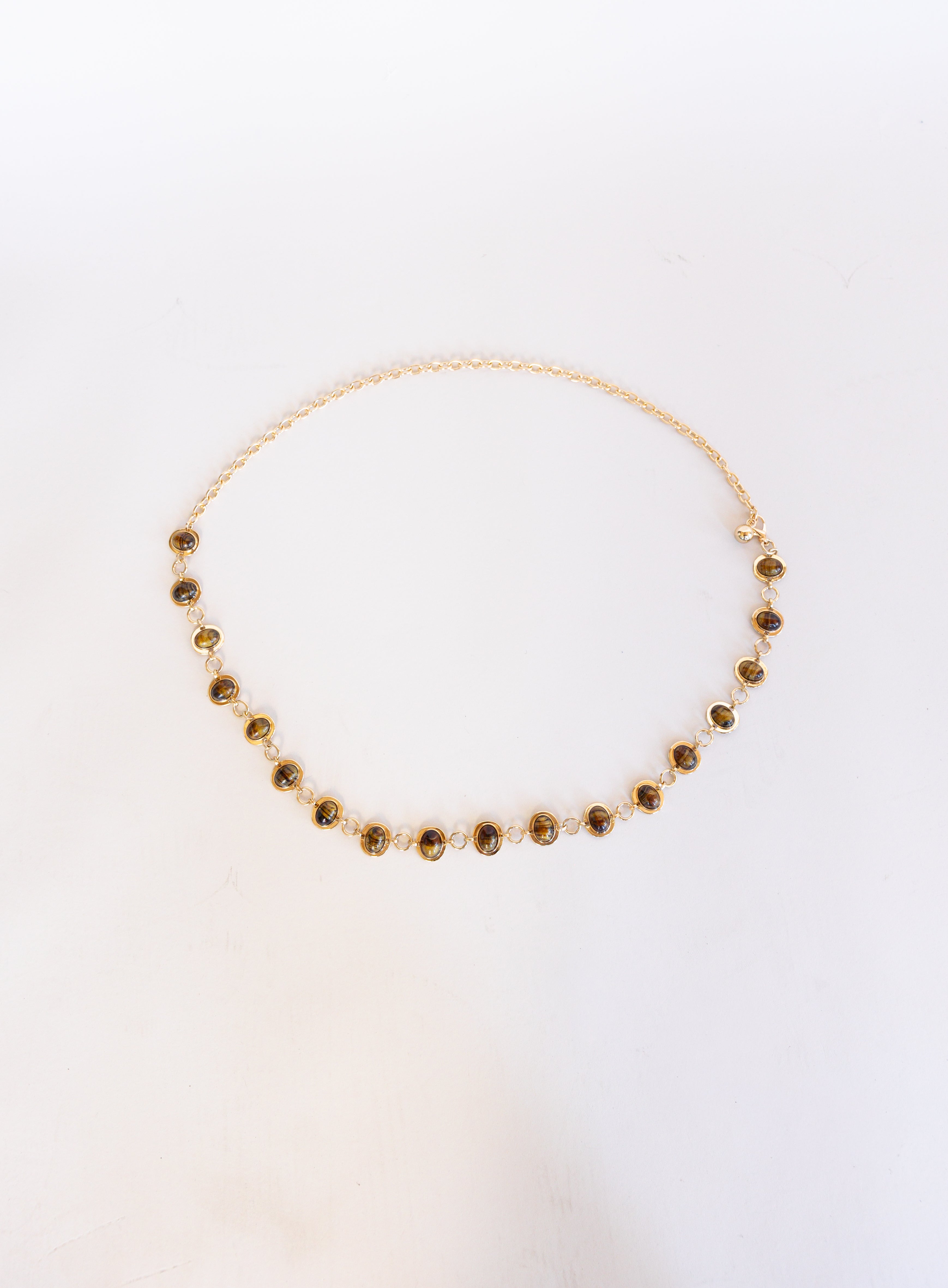 Rosalind Chain Belt, a gold-tone chain belt with glossy tortoise-tone stones