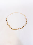 Rosalind Chain Belt, a gold-tone chain belt with glossy tortoise-tone stones