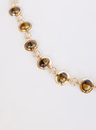 Rosalind Chain Belt, a gold-tone chain belt with glossy tortoise-tone stones