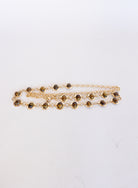 Rosalind Chain Belt, a gold-tone chain belt with glossy tortoise-tone stones