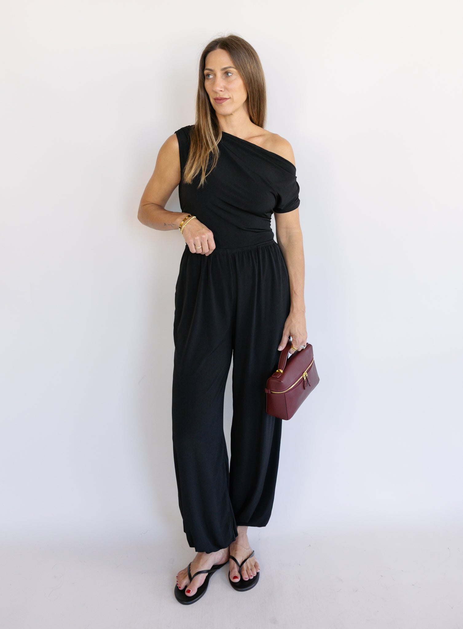 Woman wearing the Azalea Balloon Pants, black lightweight balloon-leg pants with gathered ankle cuffs