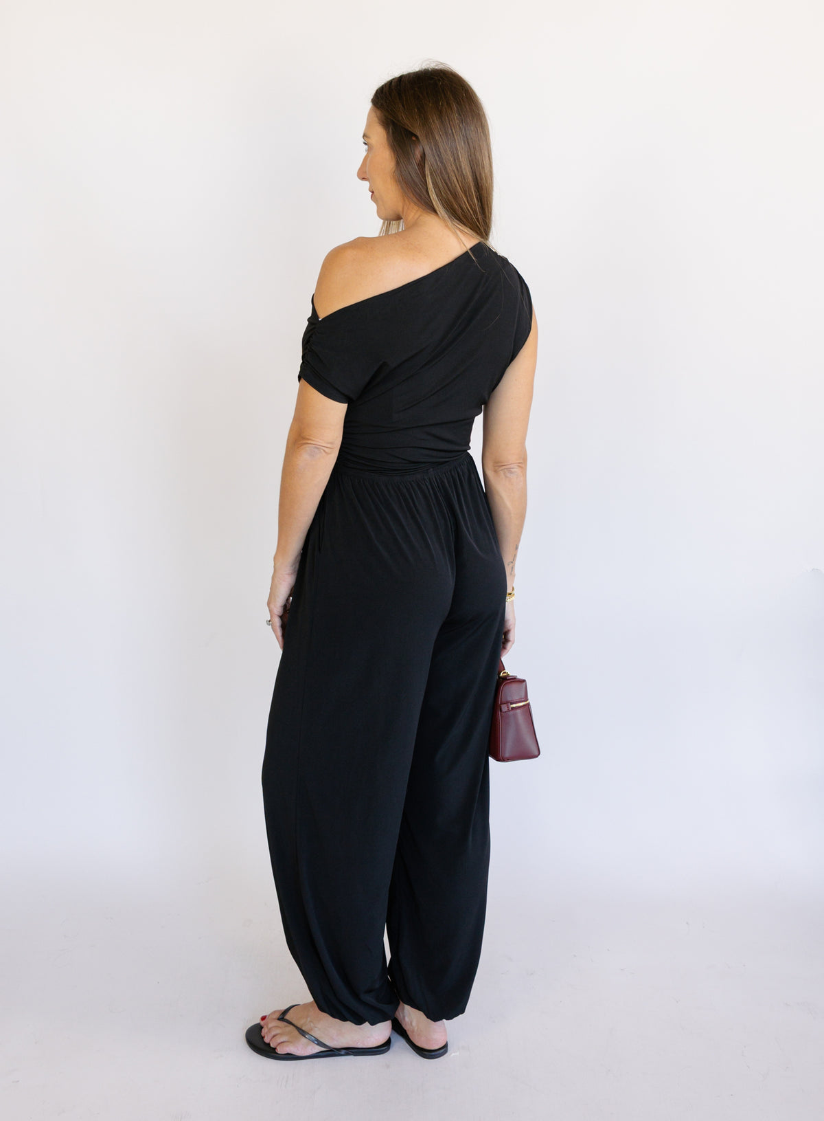 Woman wearing the Azalea Balloon Pants, black lightweight balloon-leg pants with gathered ankle cuffs