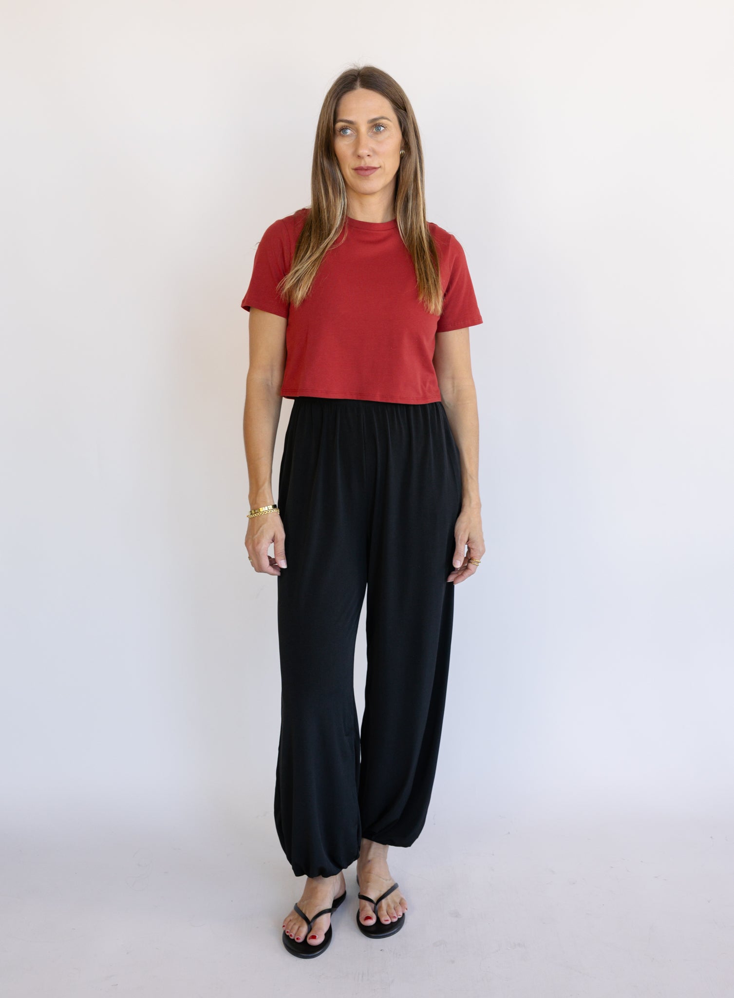 Woman wearing Favorite Daughter The Laura Crop Top in Winery, a fitted cropped crewneck tee