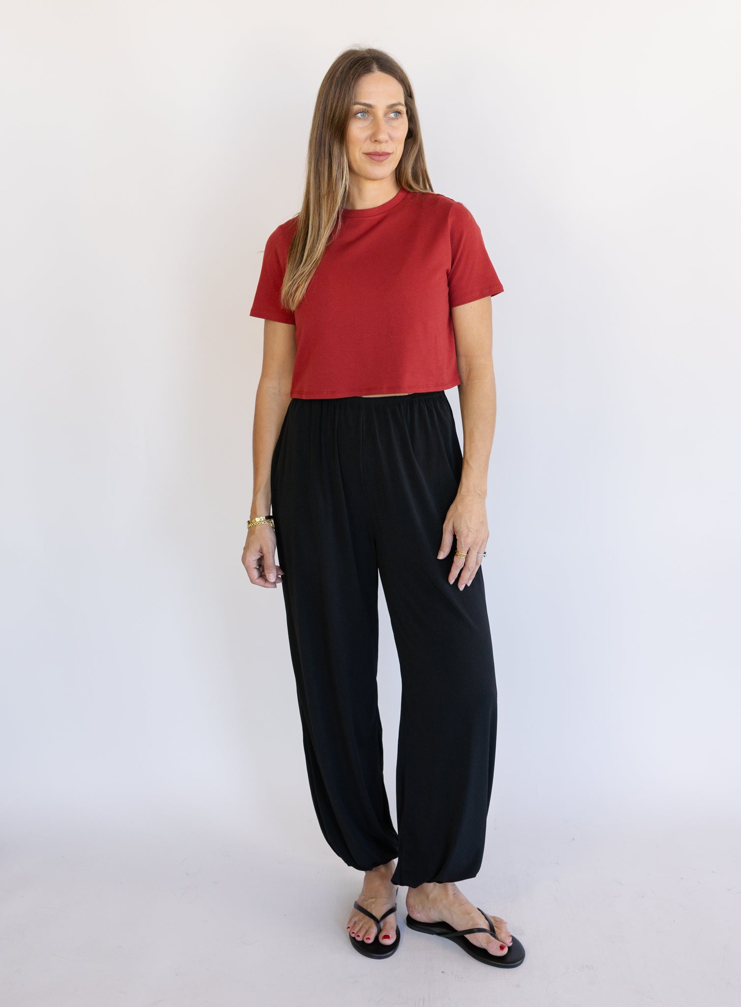 Woman wearing Favorite Daughter The Laura Crop Top in Winery, a fitted cropped crewneck tee