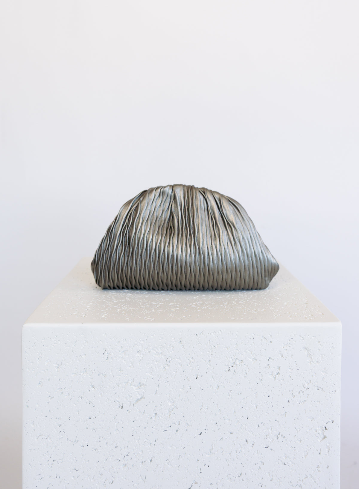 Mallory Clutch, a metallic pewter pleated clutch with a detachable gold chain strap