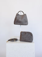 Lucia Bag in Taupe, a slouchy suede hobo bag with a rounded top handle