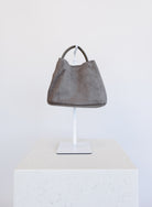 Lucia Bag in Taupe, a slouchy suede hobo bag with a rounded top handle