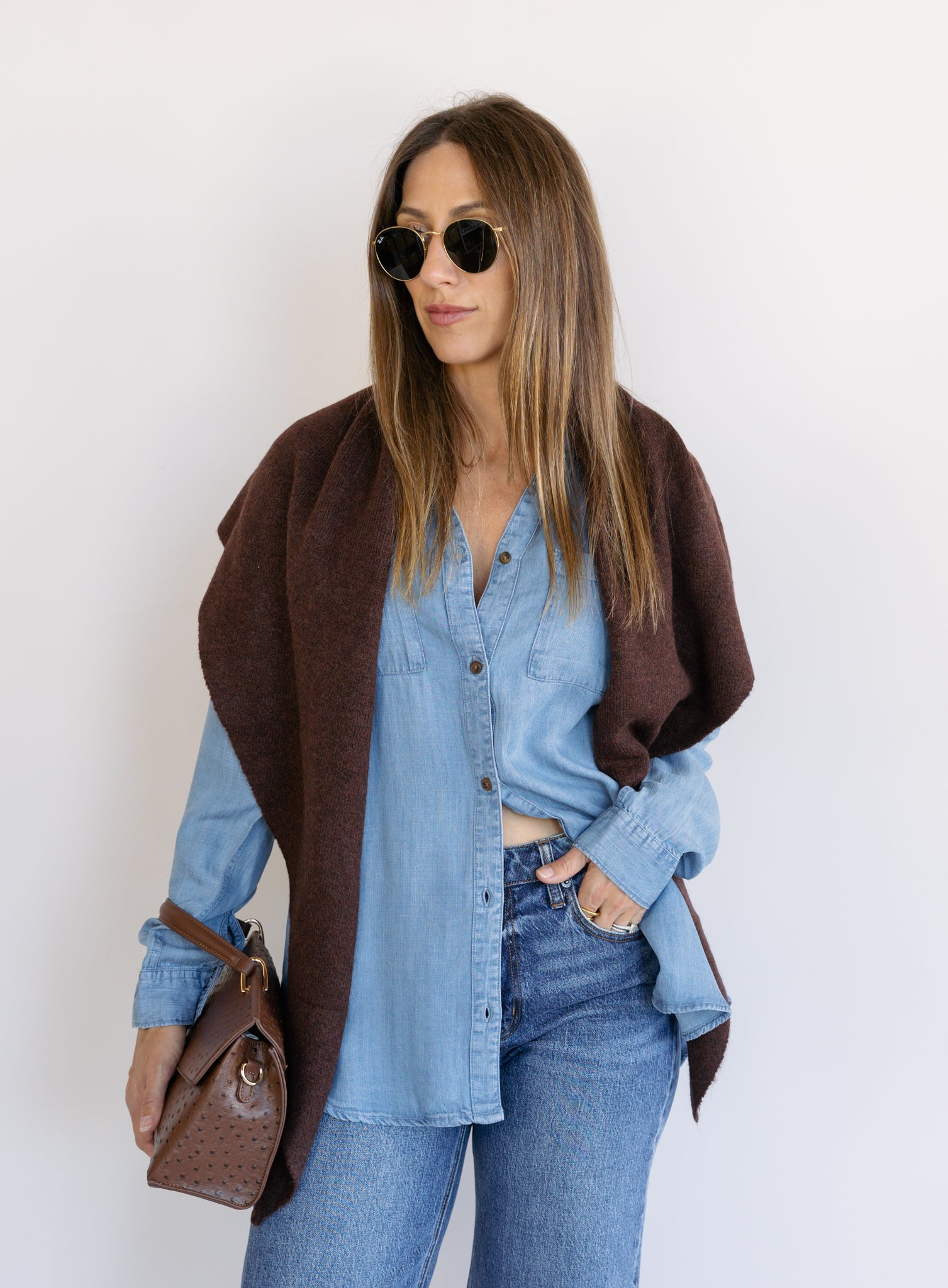 Woman wearing the Ginger Shirt, a light denim wash Tencel button-front chambray shirt