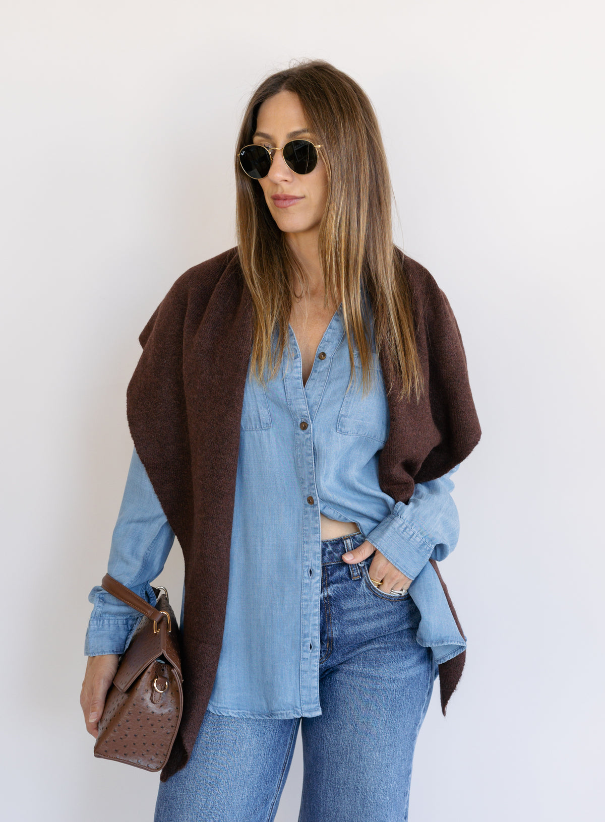 Woman wearing the Ginger Shirt, a light denim wash Tencel button-front chambray shirt