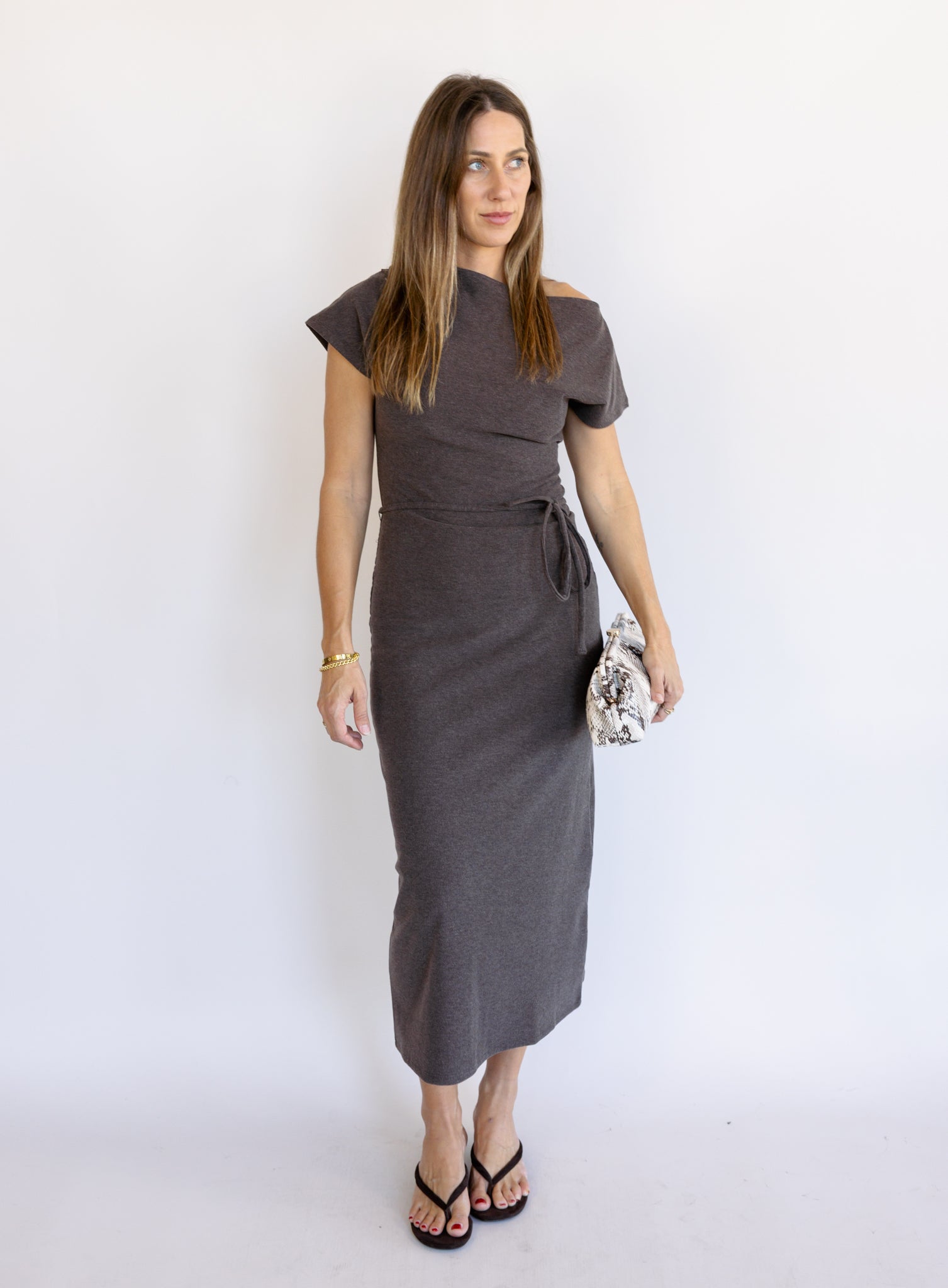 Woman wearing the Project Social T Laurel Dress, an off-the-shoulder brushed rib maxi dress with a waist tie