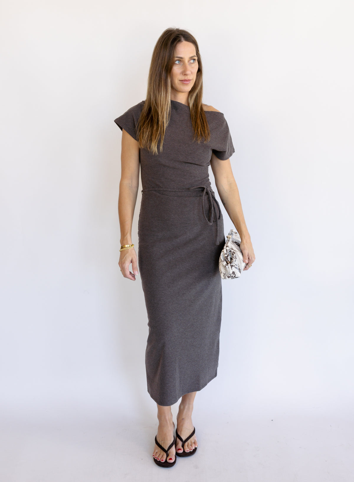 Woman wearing the Project Social T Laurel Dress, an off-the-shoulder brushed rib maxi dress with a waist tie