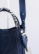Giselle Suede Bag in Navy, a slouchy suede tote with navy and white leopard scarves on the handles