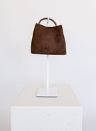 Lucia Bag in Chocolate, a slouchy suede hobo bag with a rounded top handle