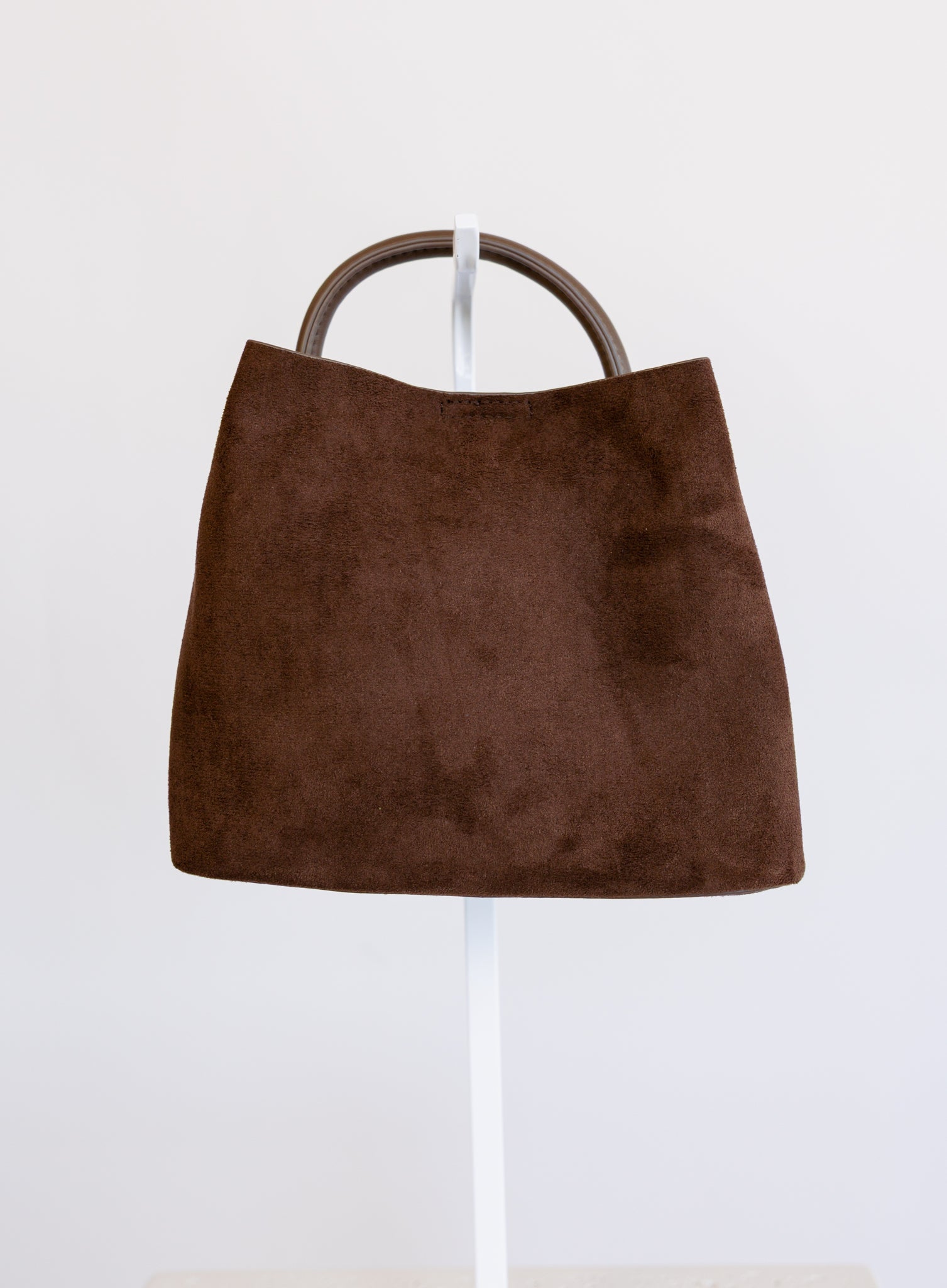 Lucia Bag in Chocolate, a slouchy suede hobo bag with a rounded top handle