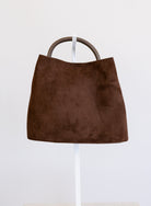 Lucia Bag in Chocolate, a slouchy suede hobo bag with a rounded top handle
