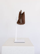 Lucia Bag in Chocolate, a slouchy suede hobo bag with a rounded top handle
