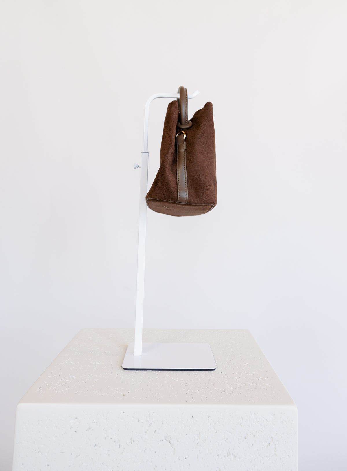 Lucia Bag in Chocolate, a slouchy suede hobo bag with a rounded top handle
