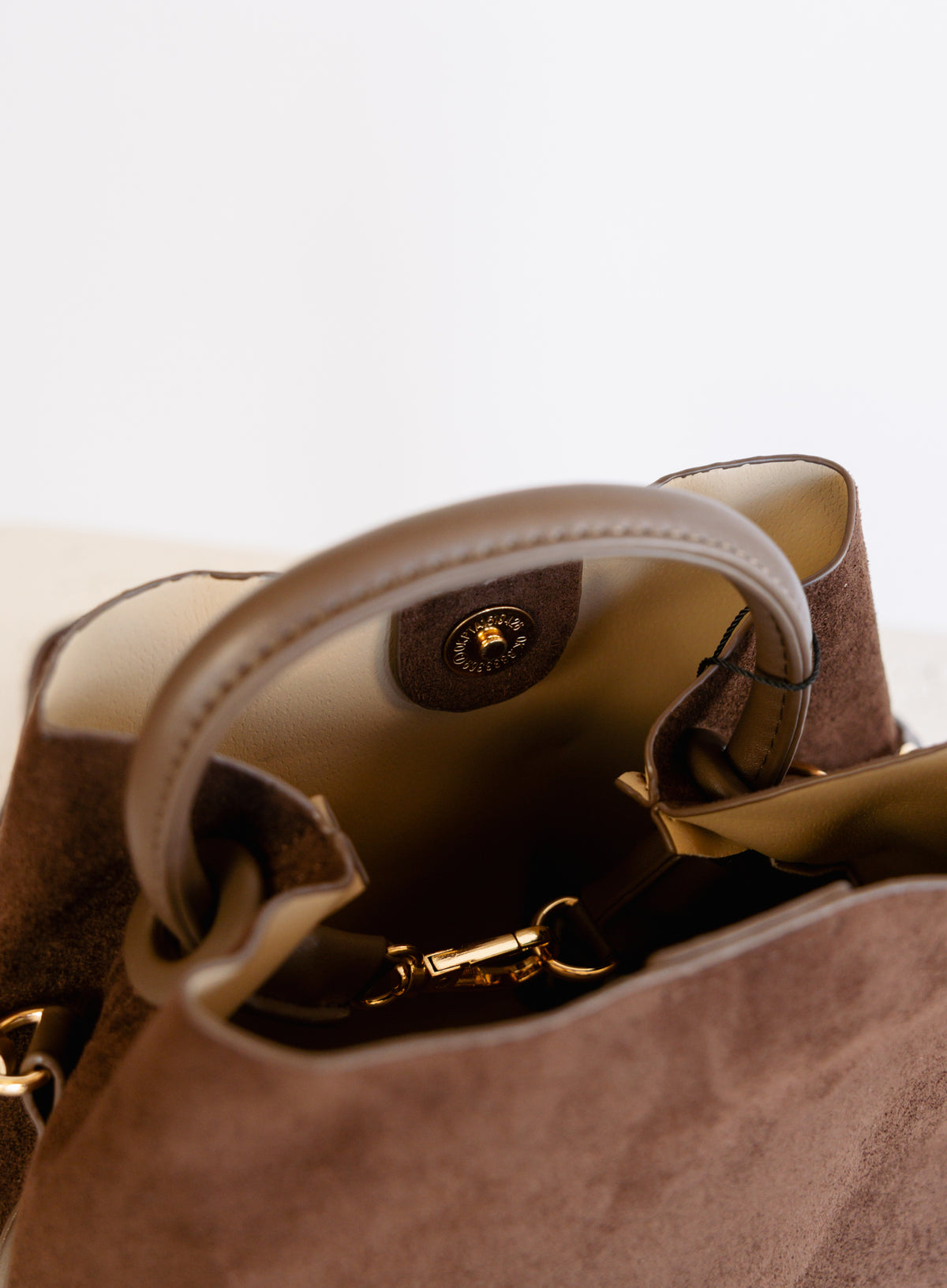 Lucia Bag in Chocolate, a slouchy suede hobo bag with a rounded top handle