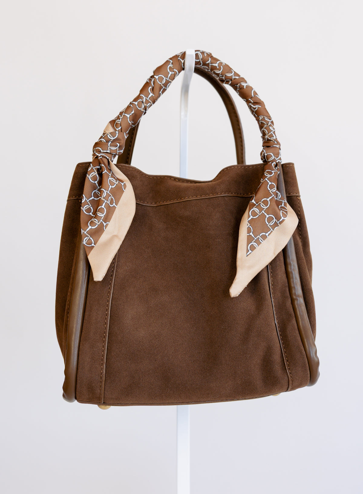 Giselle Suede Bag in Chocolate, a slouchy suede tote with cream chain-print scarves on the handles