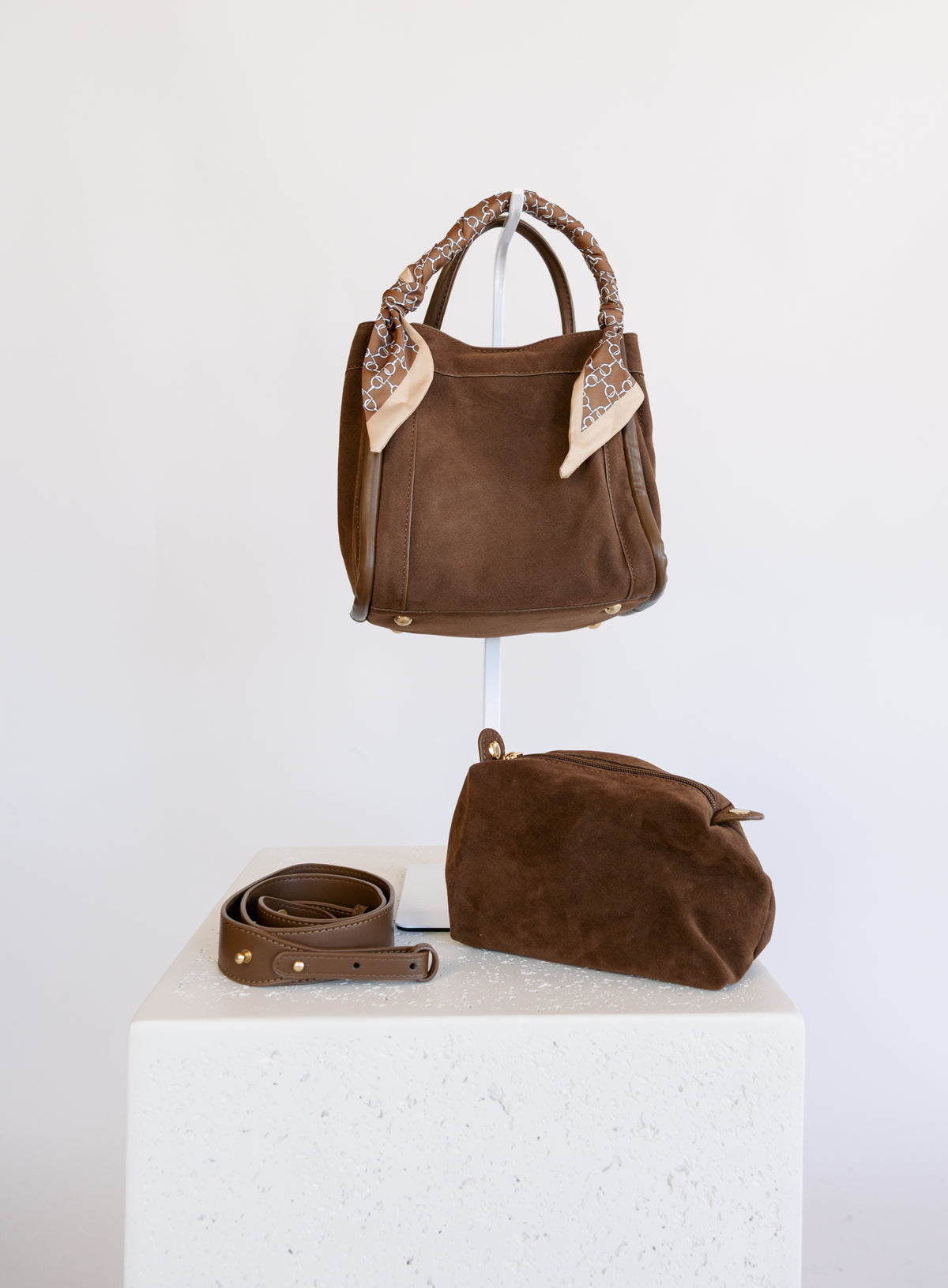 Giselle Suede Bag in Chocolate, a slouchy suede tote with cream chain-print scarves on the handles