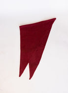 Woman wearing the Wrenley Warm Shawl Scarf in Red, a wine red knit triangle shawl