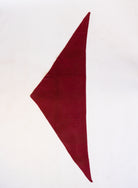 Woman wearing the Wrenley Warm Shawl Scarf in Red, a wine red knit triangle shawl